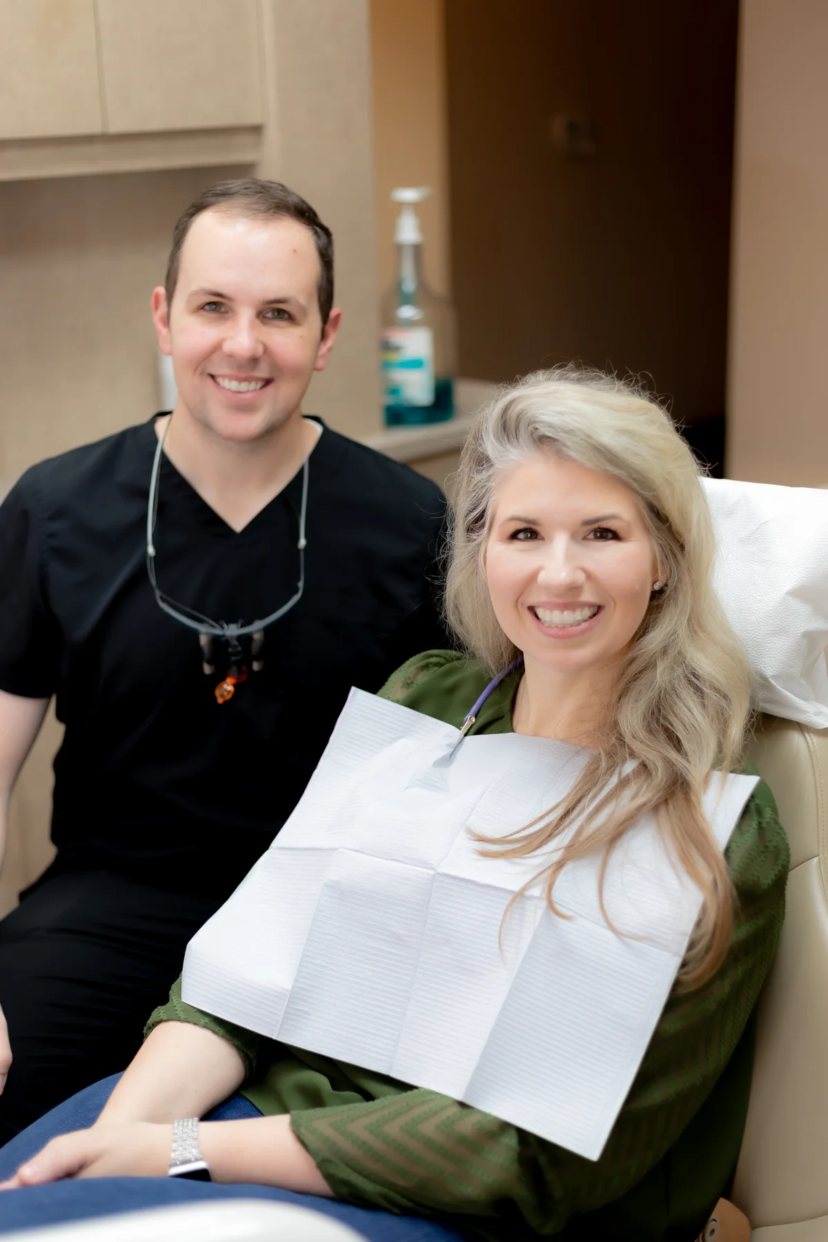 Dr. Smith and a patient smiling in the office