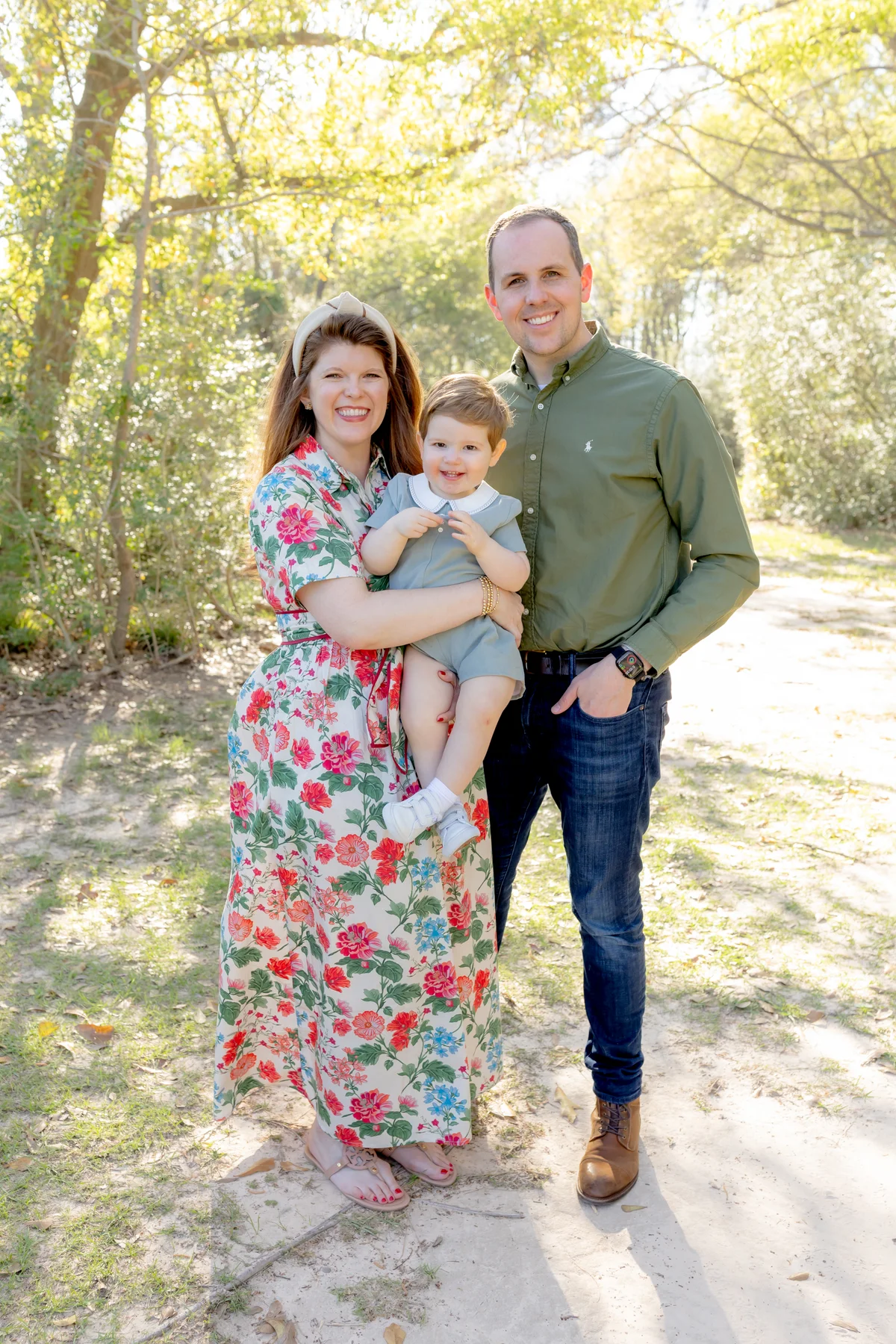 Dr. Smith with his wife, Emily, and their son outdoors